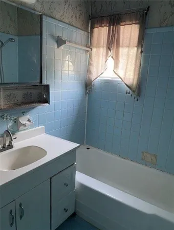 a bathroom with a sink and a bathtub