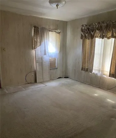 a view of a room with a windows and closet