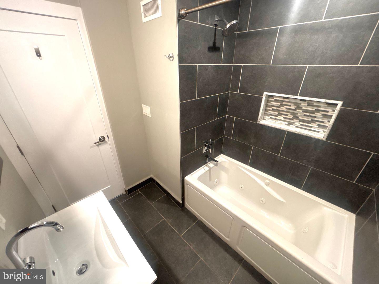 533 Manton Street Philadelphia, PA 19147 - Photo 12 of 22 a bathroom with a bathtub and a sink