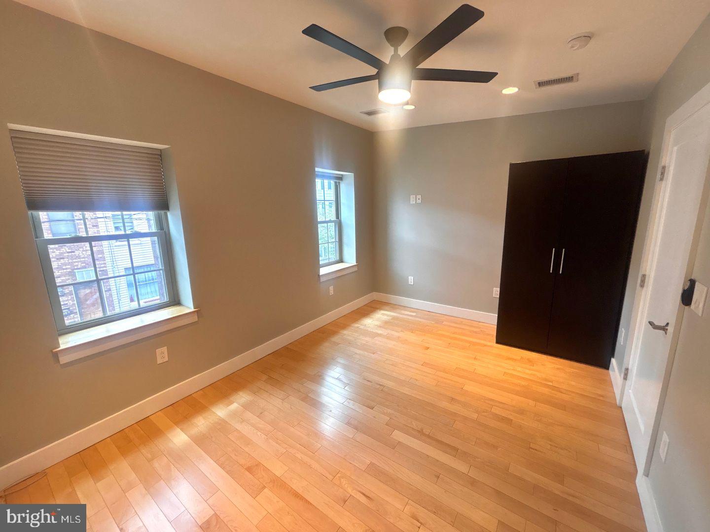 533 Manton Street Philadelphia, PA 19147 - Photo 13 of 22 a view of empty room with wooden floor and fan