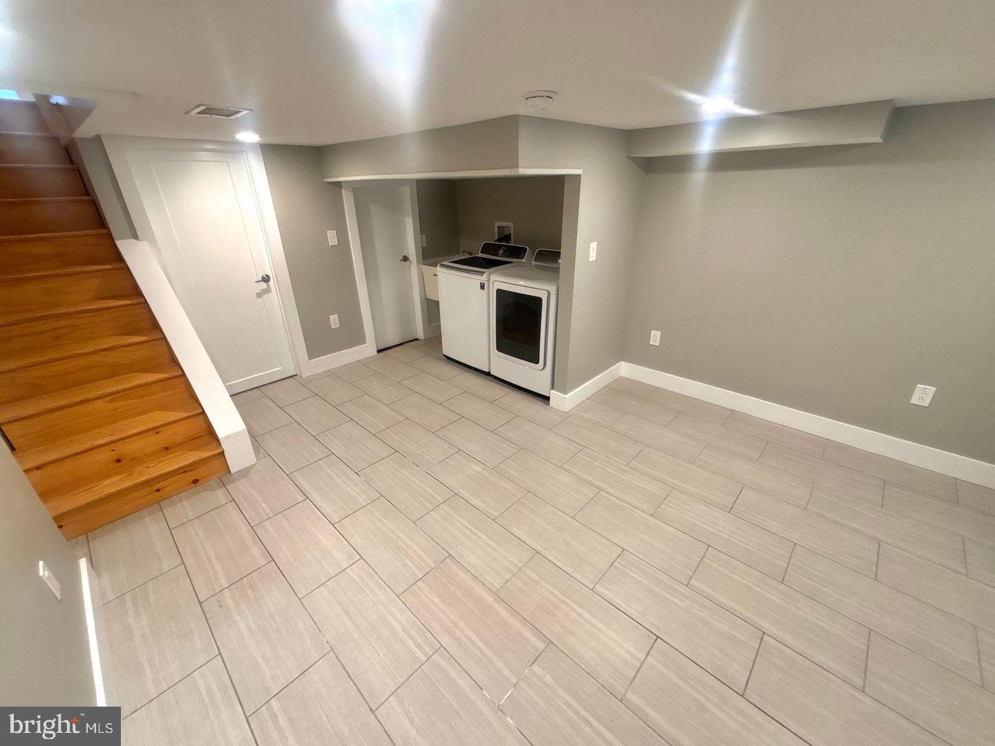 533 Manton Street Philadelphia, PA 19147 - Photo 20 of 22 an empty room with wooden floor and windows