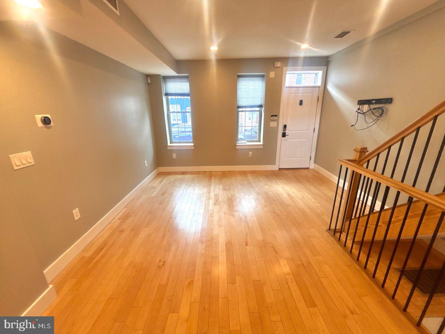 533 Manton Street Philadelphia, PA 19147 - Photo 5 of 22 wooden floor in a hall with a window