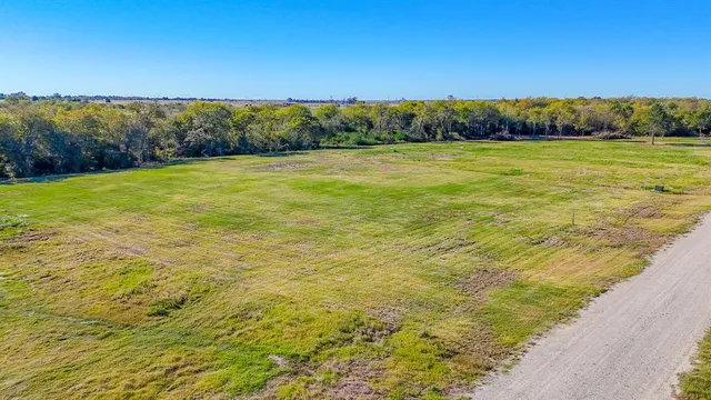 a view of a yard with an ocean view