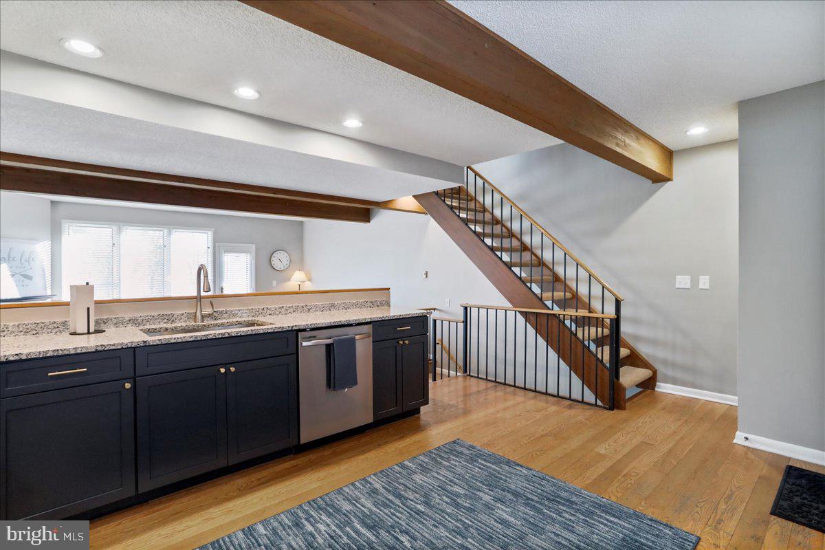 76 Bright Passage McHenry, MD 21541 - Photo 11 of 63 a open kitchen with stainless steel appliances granite countertop a sink and a wooden floor