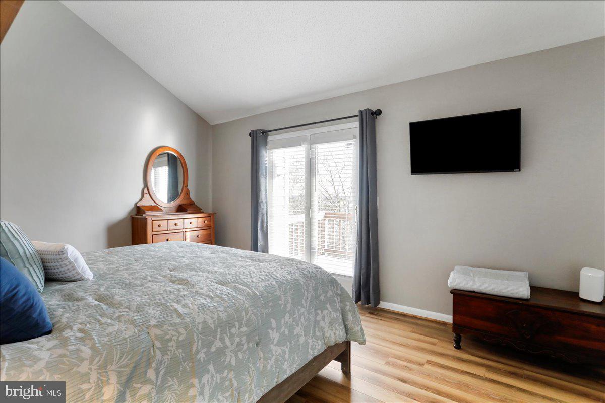 76 Bright Passage McHenry, MD 21541 - Photo 17 of 63 a bedroom with a bed and a flat screen tv