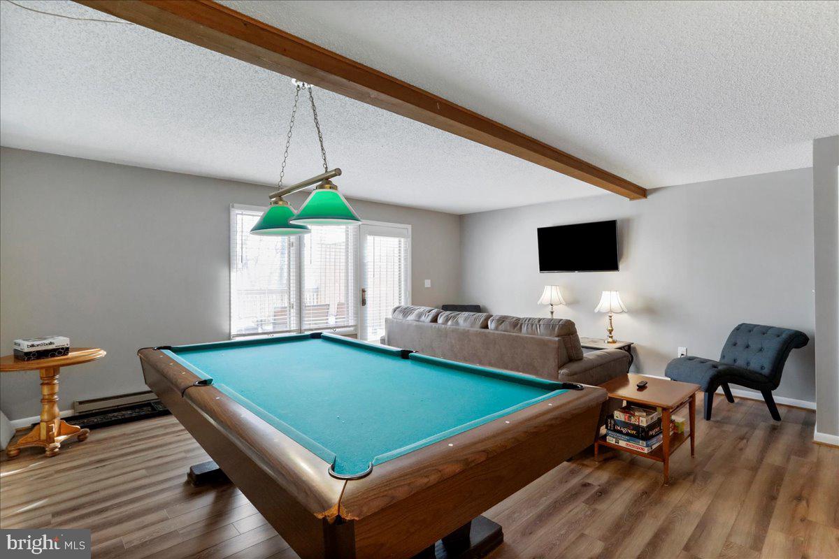 76 Bright Passage McHenry, MD 21541 - Photo 29 of 63 a living room with pool table furniture and a wooden floor