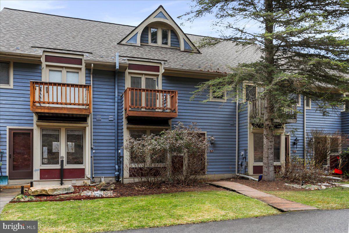 76 Bright Passage McHenry, MD 21541 - Photo 37 of 63 a front view of a house with a yard