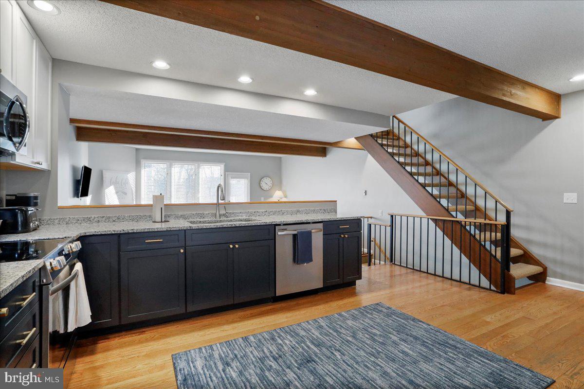76 Bright Passage McHenry, MD 21541 - Photo 10 of 63 a kitchen with stainless steel appliances granite countertop a stove and cabinets