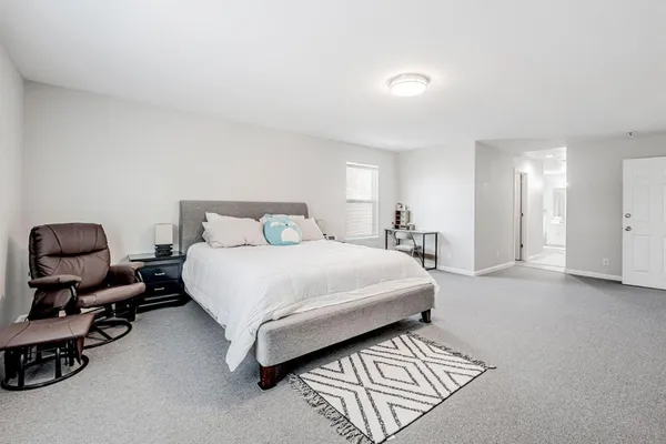 a bedroom with a bed and furniture