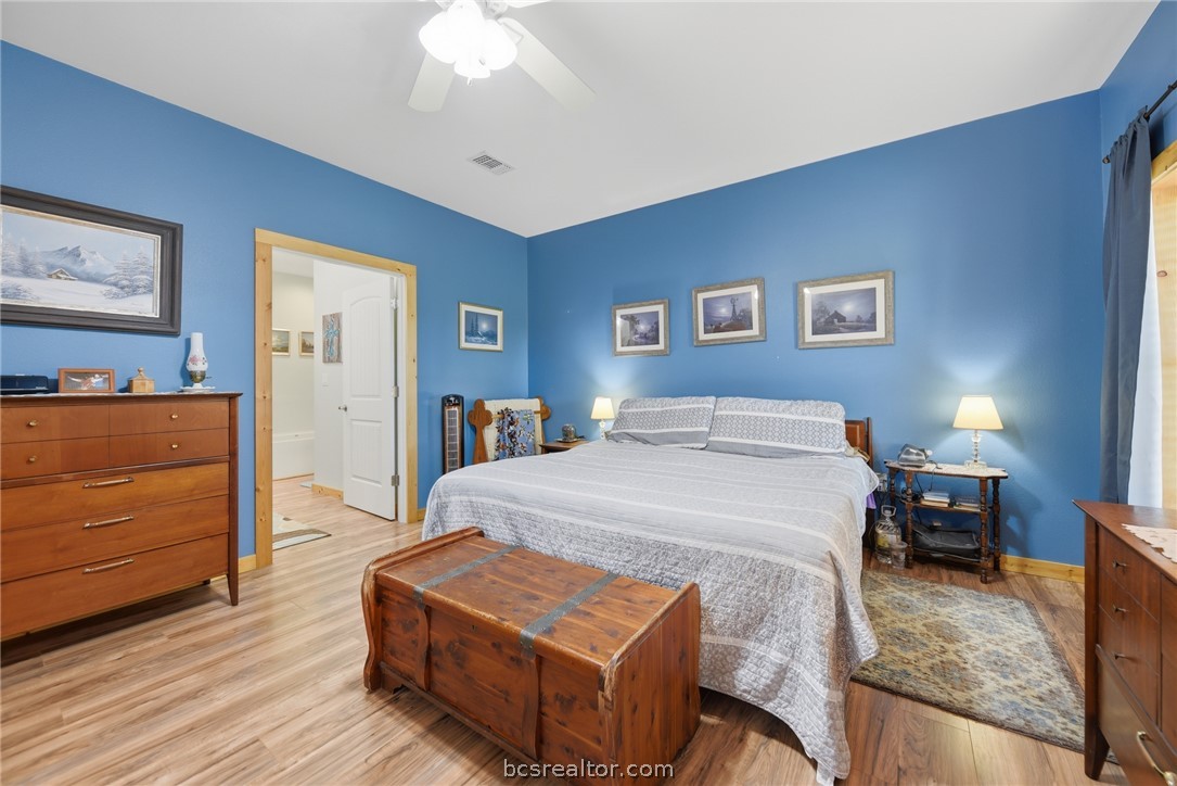 126 South Berlin Road Brenham, TX 77833 - Photo 15 of 30 a bedroom with a bed and a dresser