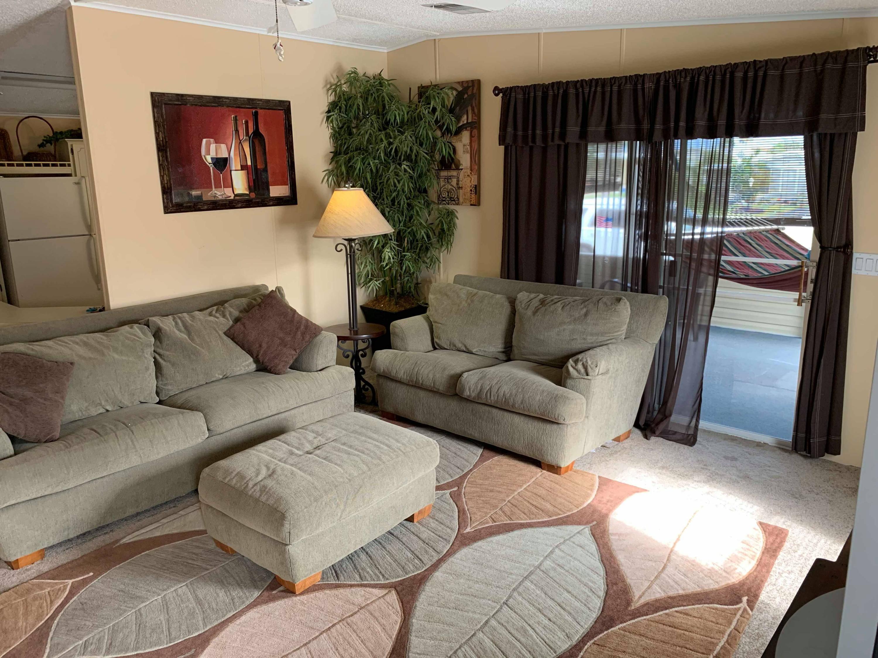 1531 Southwest 65th Avenue Boca Raton, FL 33428 - Photo 11 of 25 a living room with furniture and a large window