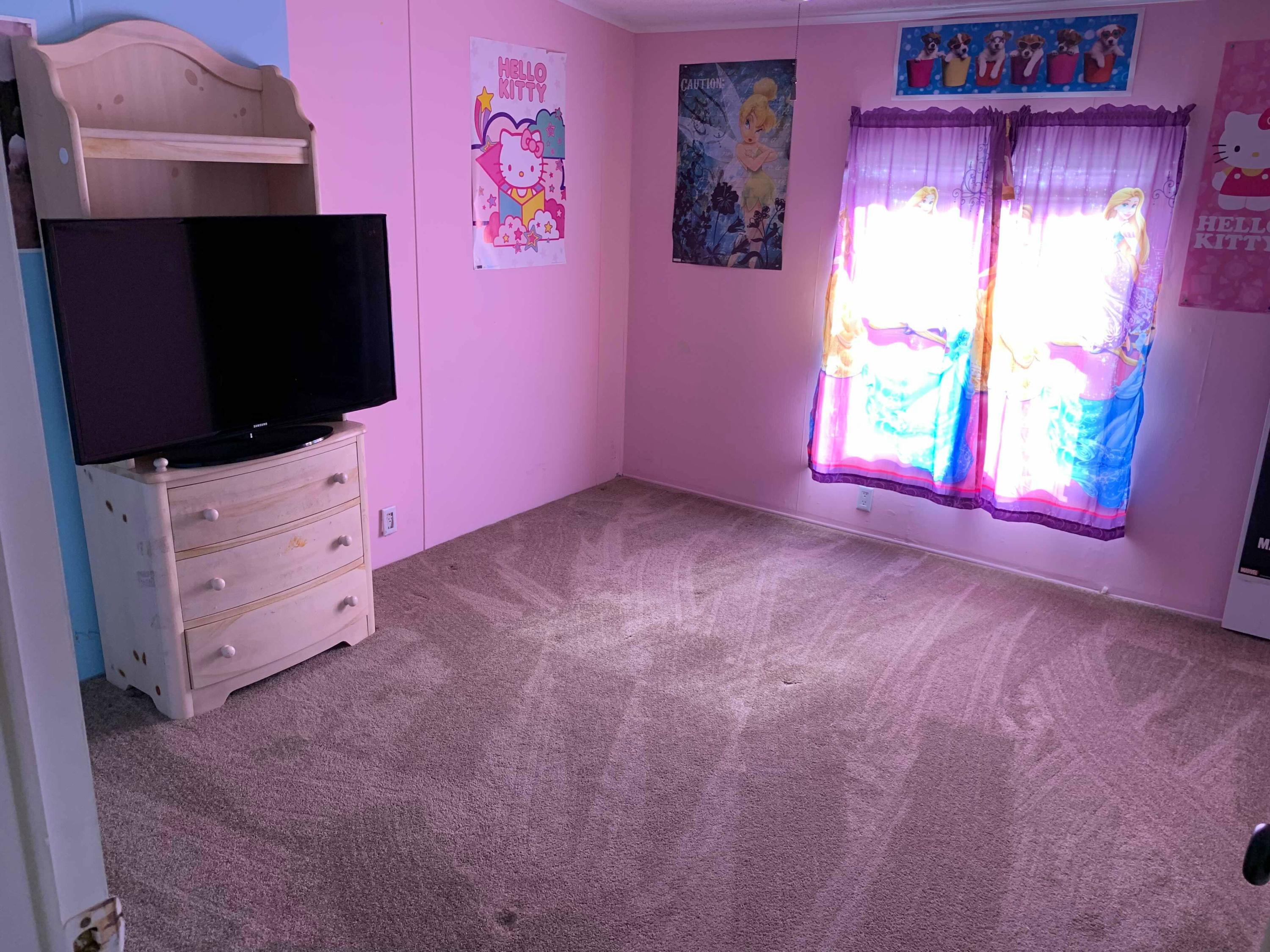 1531 Southwest 65th Avenue Boca Raton, FL 33428 - Photo 17 of 25 a view of an empty room with a flat screen tv