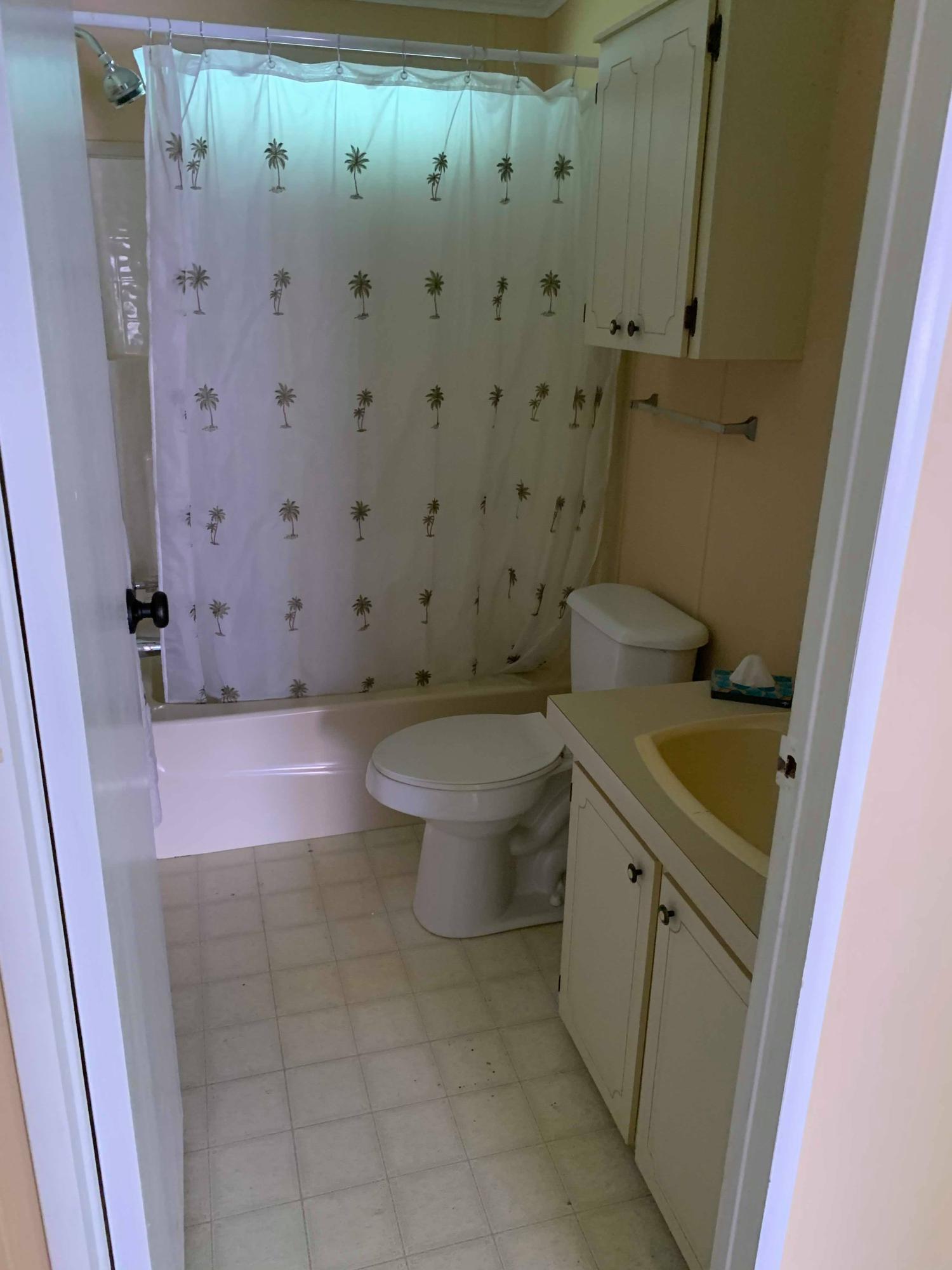 1531 Southwest 65th Avenue Boca Raton, FL 33428 - Photo 18 of 25 a bathroom with a granite countertop sink toilet and shower