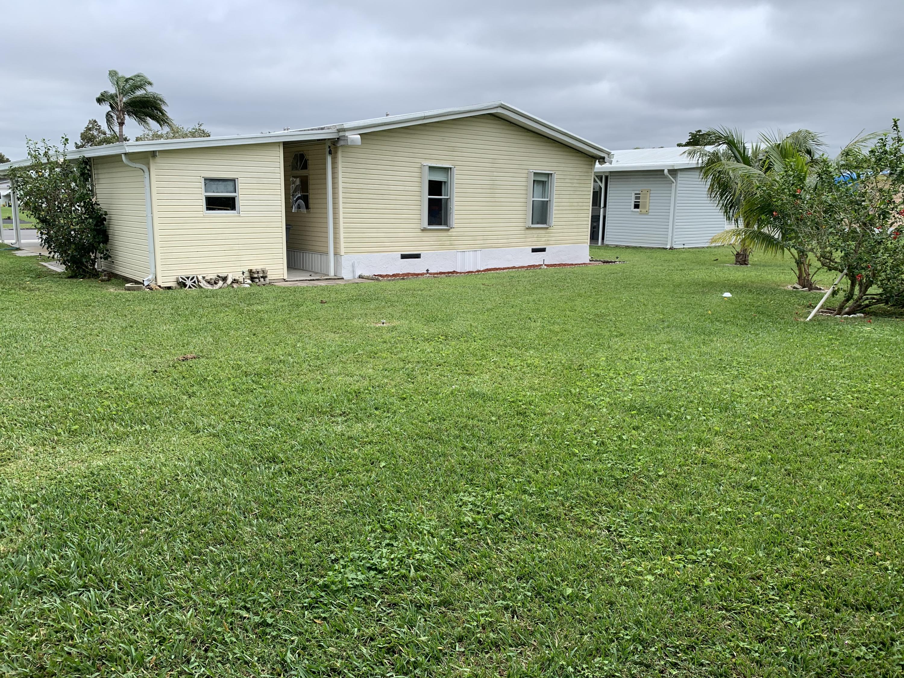 1531 Southwest 65th Avenue Boca Raton, FL 33428 - Photo 3 of 25 a view of a house with a yard and a yard
