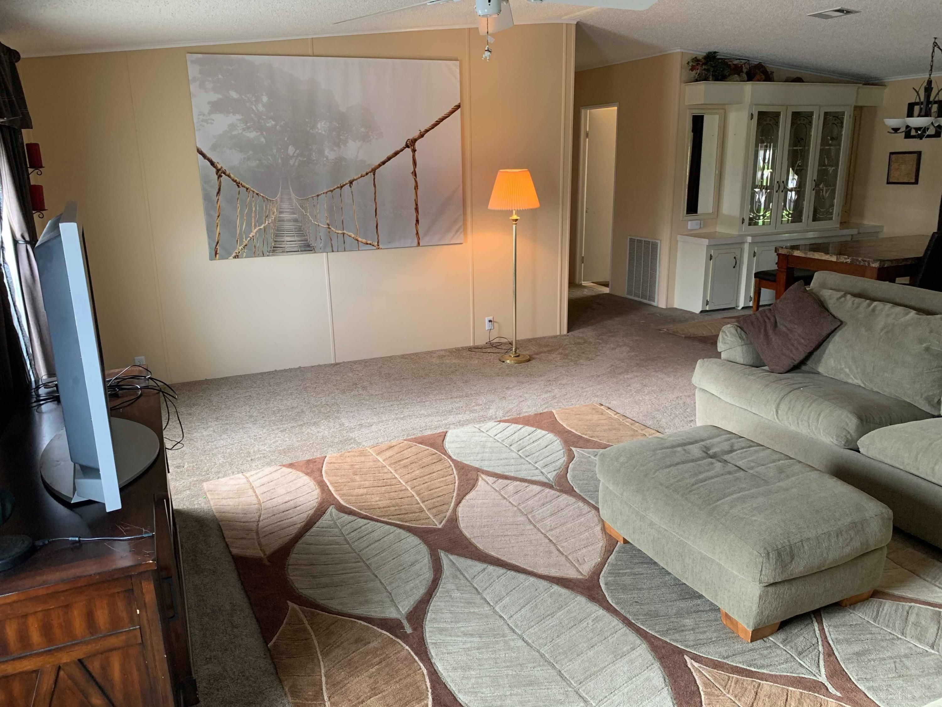 1531 Southwest 65th Avenue Boca Raton, FL 33428 - Photo 8 of 25 a living room with furniture and a flat screen tv