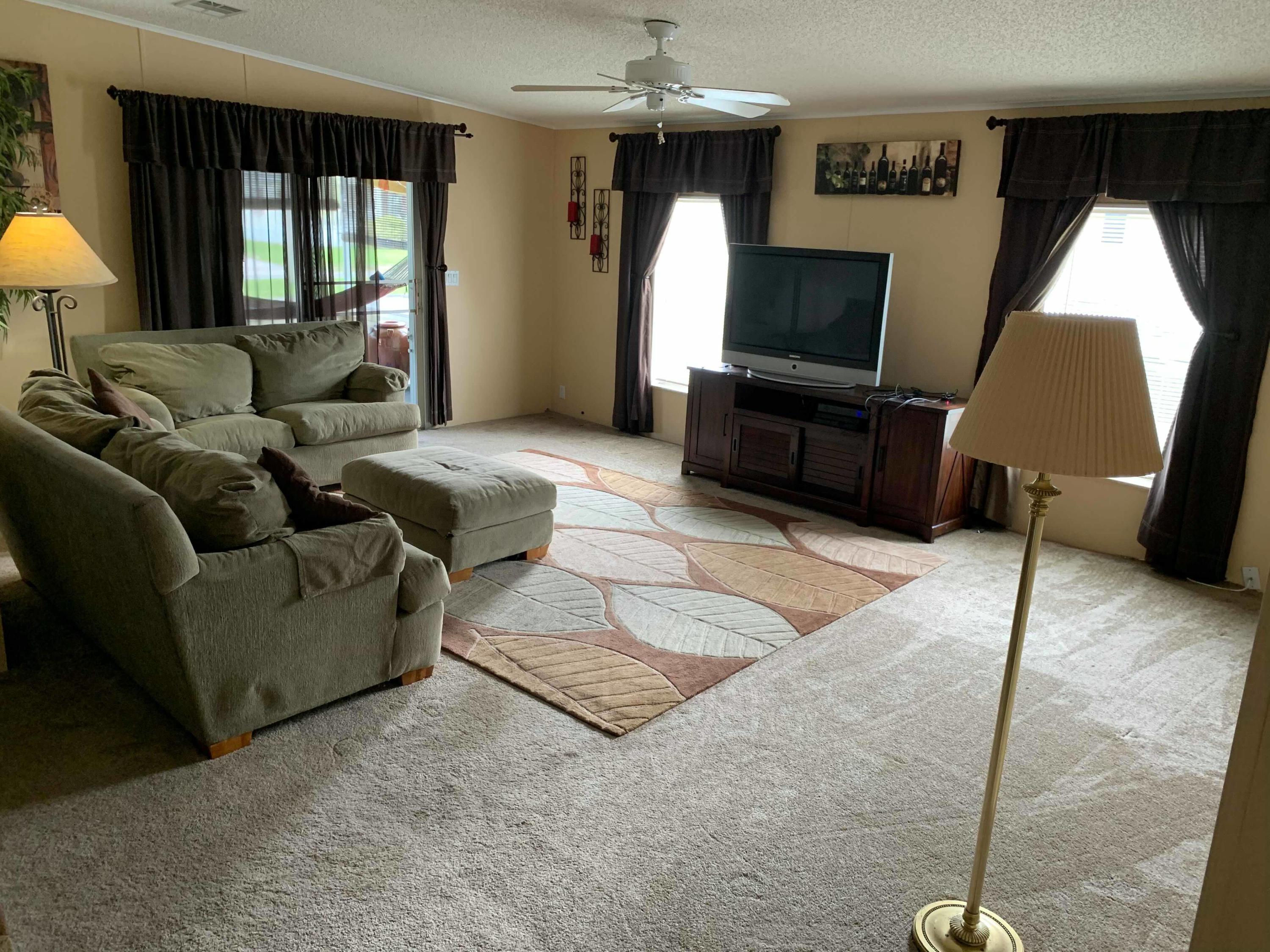1531 Southwest 65th Avenue Boca Raton, FL 33428 - Photo 10 of 25 a living room with furniture and a flat screen tv