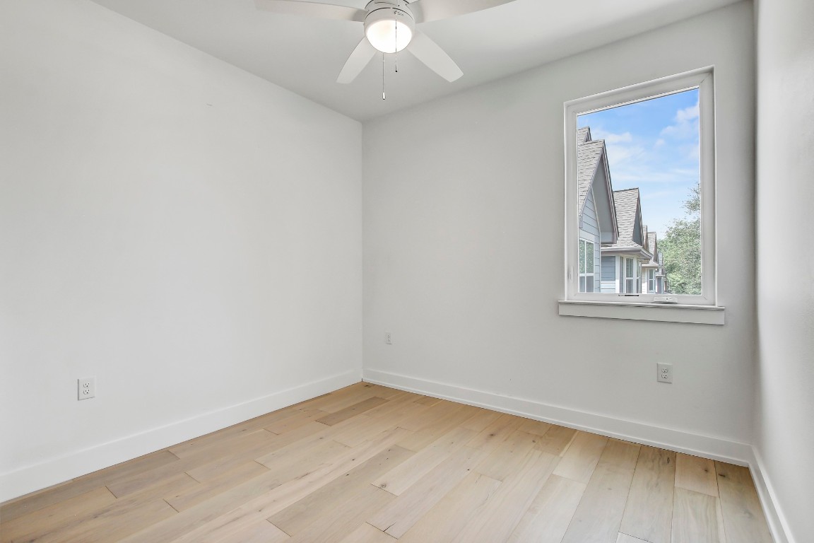 4127 East 12th Street, Unit 3 Austin, TX 78721 - Photo 6 of 29 an empty room with a window