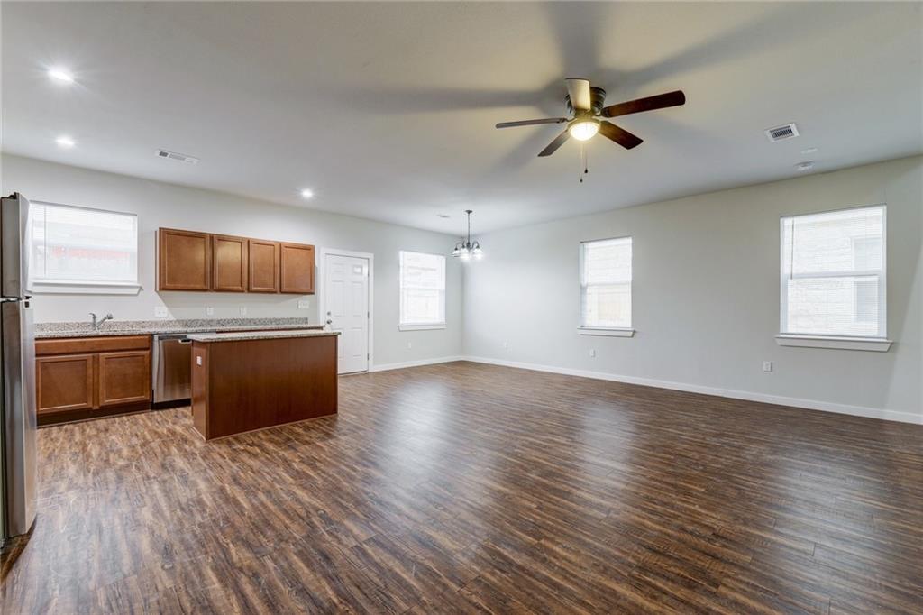 906 Quartz Court, Unit 601 Cedar Park, TX 78613 - Photo 14 of 15 a view of kitchen with sink a microwave and wooden floor