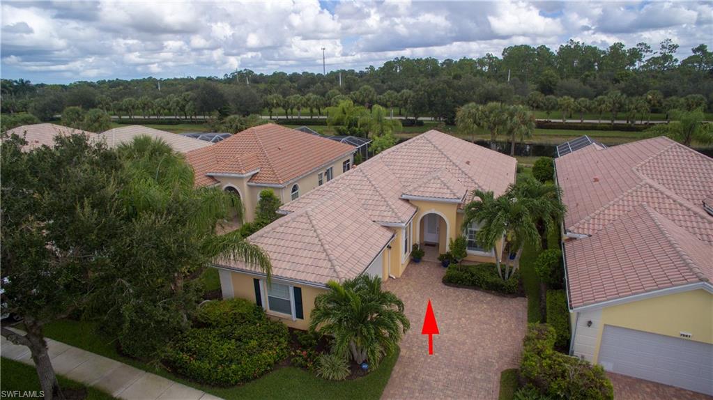 7545 Garibaldi Court Naples, FL 34114 - Photo 1 of 1 an aerial view of house with yard and mountain view in back