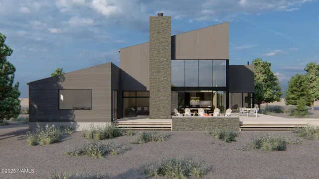 a view of living room kitchen with stainless steel appliances kitchen island granite countertop furniture and a fireplace