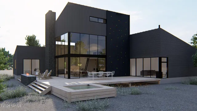 a living room with furniture tv and a floor to ceiling window