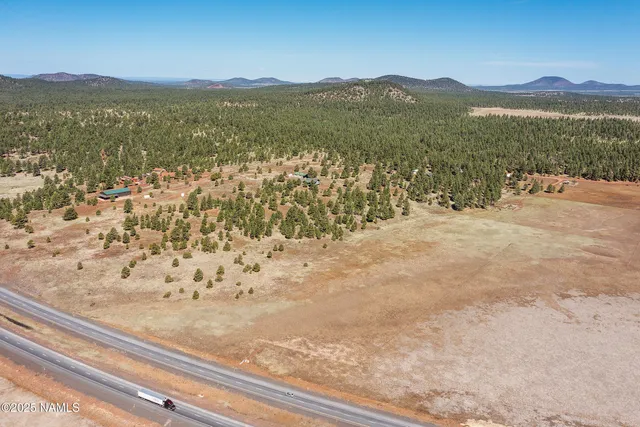 a view of an ocean beach and mountain