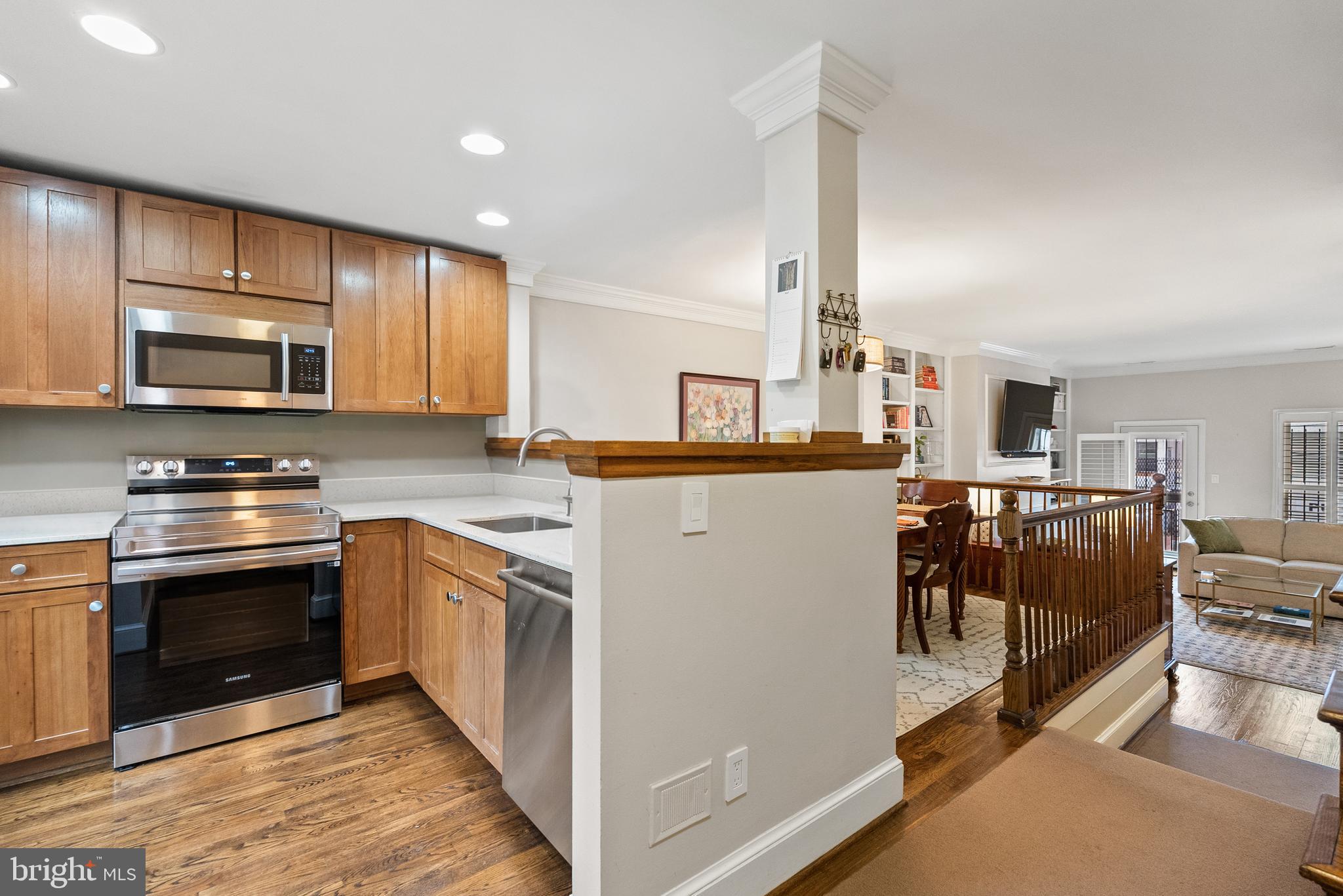 2011 Hillyer Place Northwest Washington, DC 20009 - Photo 7 of 21 a kitchen with stainless steel appliances a stove top oven a sink a counter space and cabinets