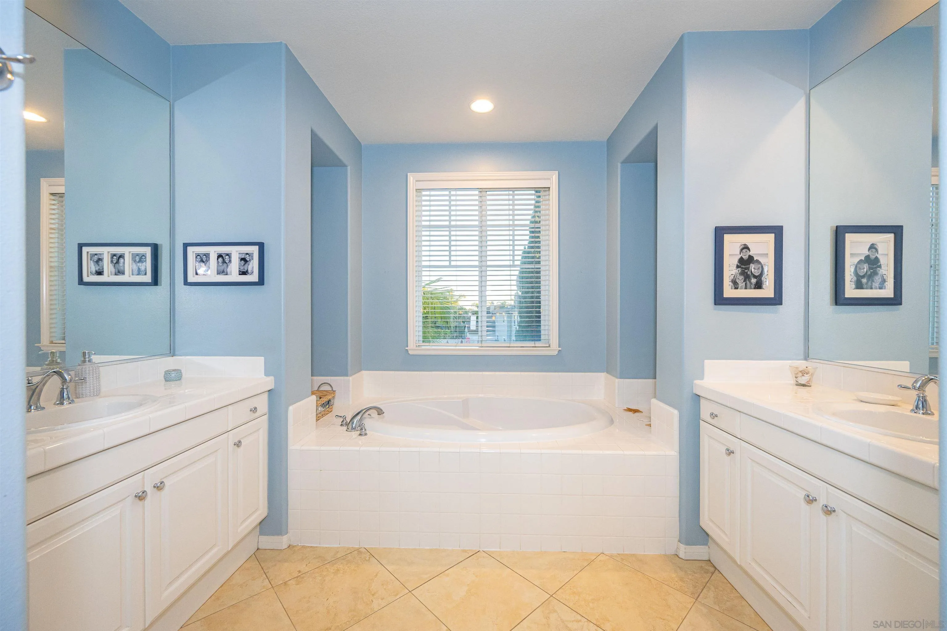 1540 Weatherly Road Carlsbad, CA 92011 - Photo 11 of 58 a spacious bathroom with a tub sink and mirror
