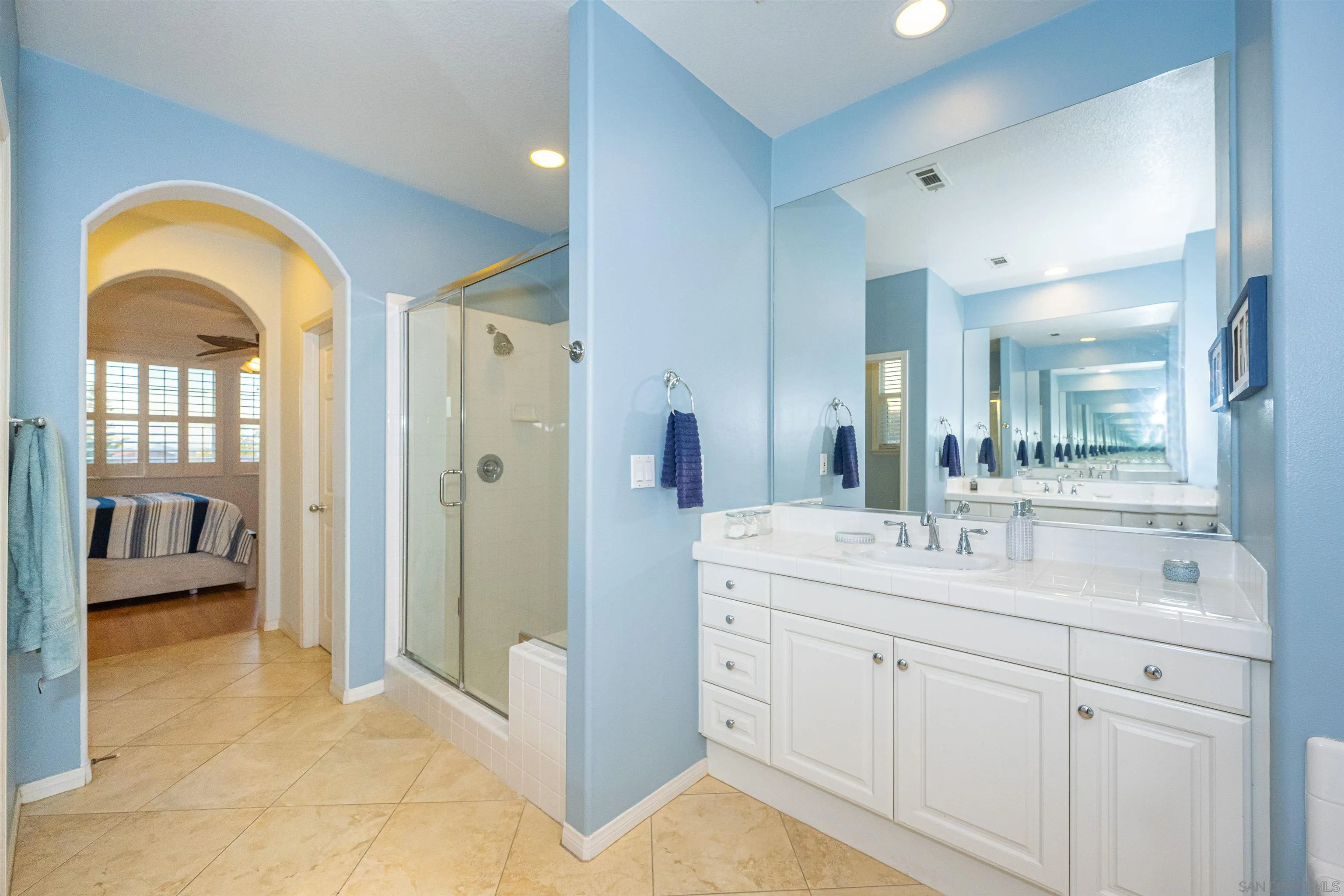 1540 Weatherly Road Carlsbad, CA 92011 - Photo 12 of 58 a spacious bathroom with a double vanity sink a mirror and a shower