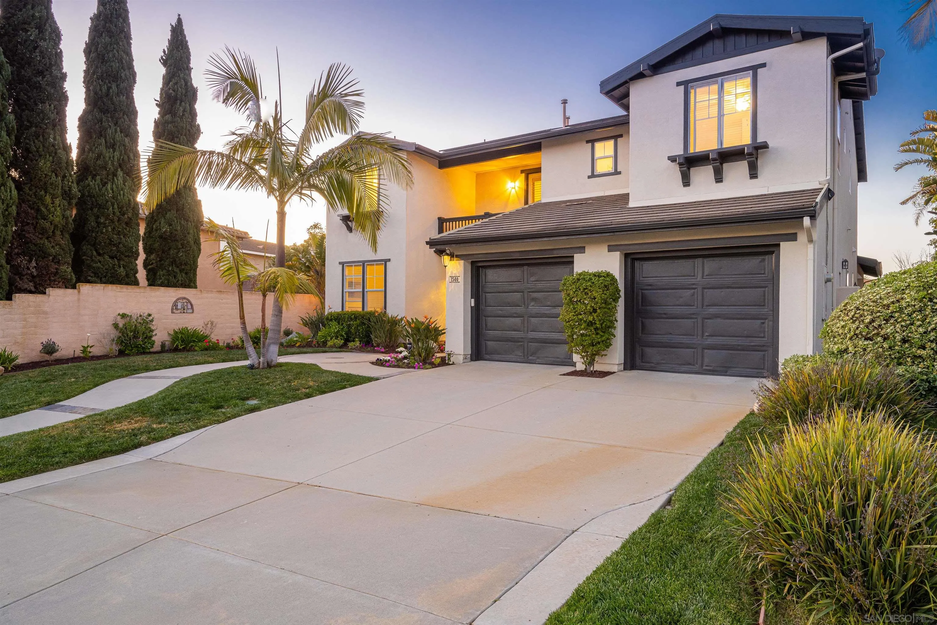 1540 Weatherly Road Carlsbad, CA 92011 - Photo 15 of 58 a front view of a house with a yard and garage
