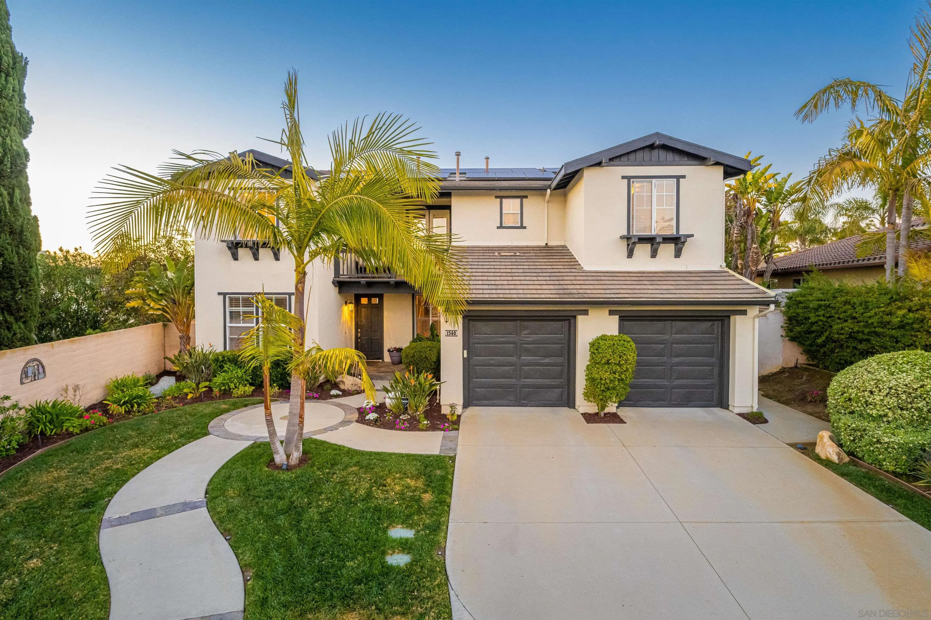 1540 Weatherly Road Carlsbad, CA 92011 - Photo 16 of 58 a front view of a house with garden