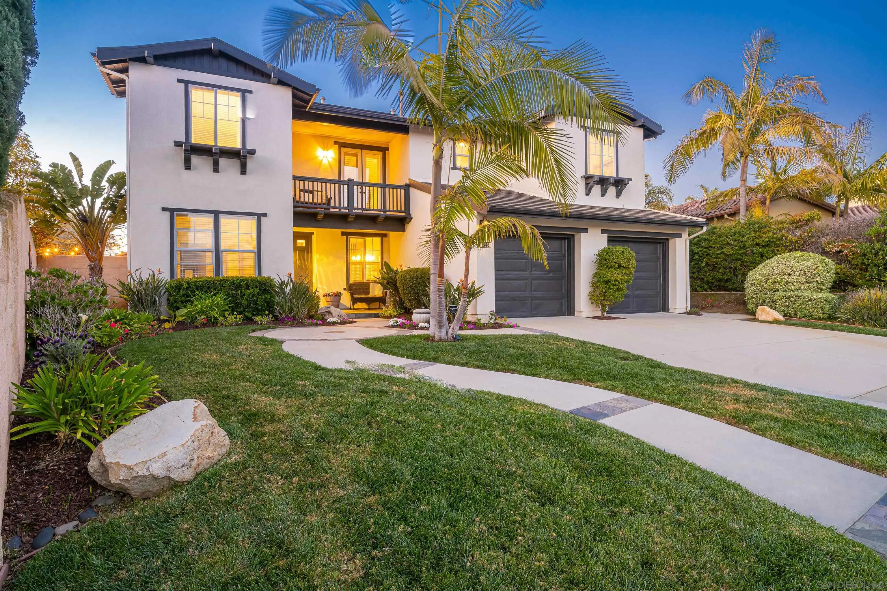 1540 Weatherly Road Carlsbad, CA 92011 - Photo 2 of 58 a front view of a house with a yard and potted plants