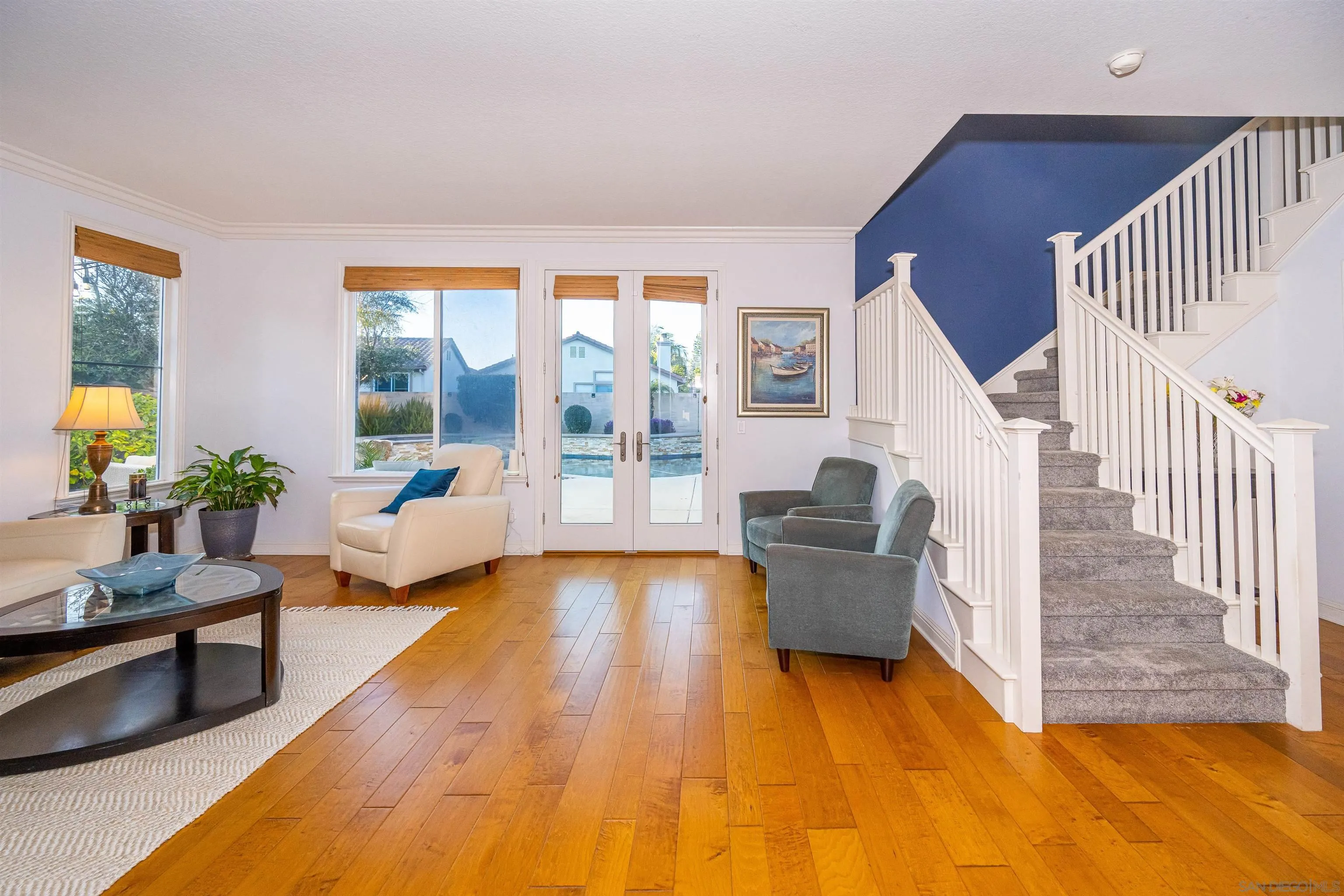 1540 Weatherly Road Carlsbad, CA 92011 - Photo 22 of 58 a living room with furniture and a large window