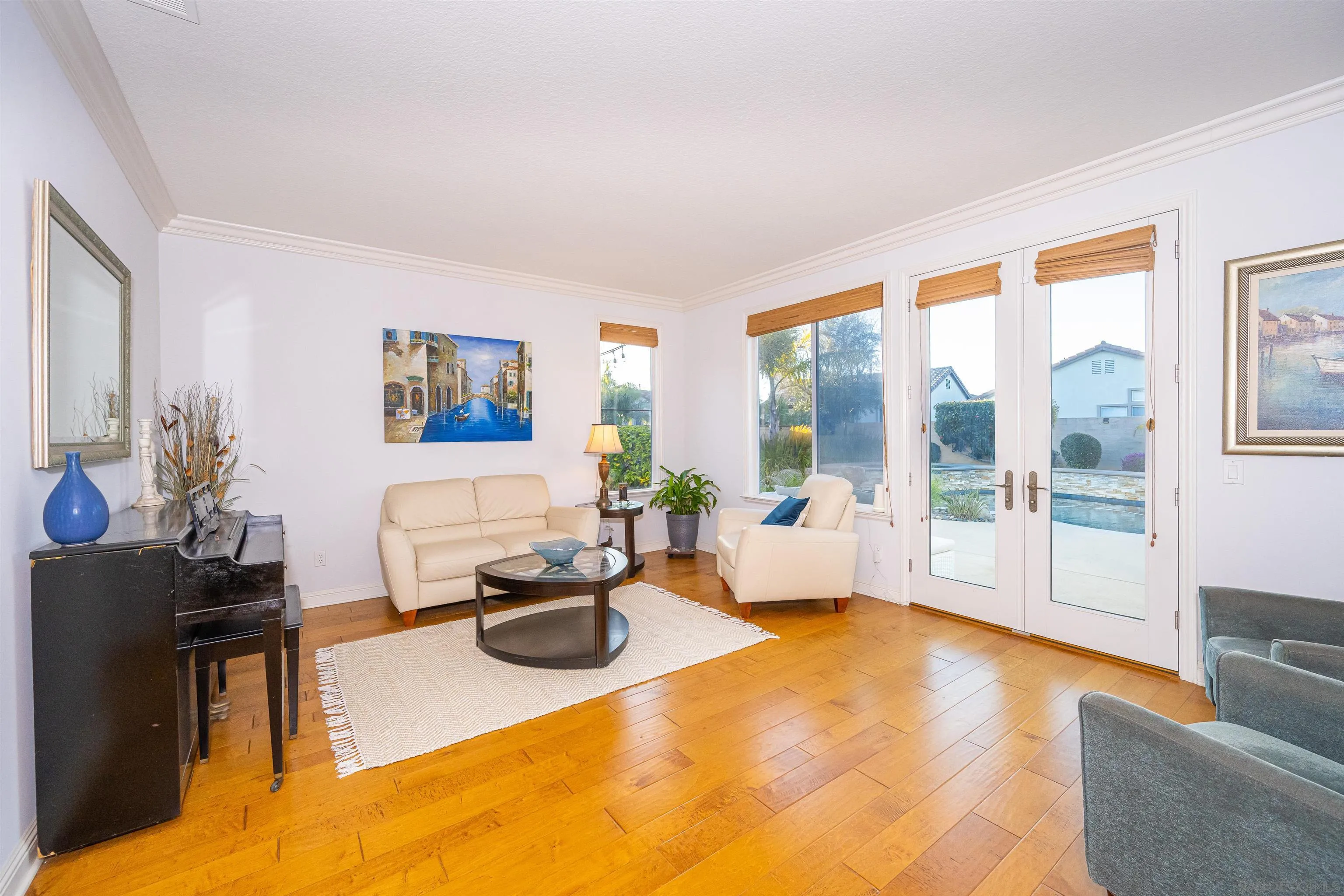 1540 Weatherly Road Carlsbad, CA 92011 - Photo 23 of 58 a living room with furniture a large window and wooden floor