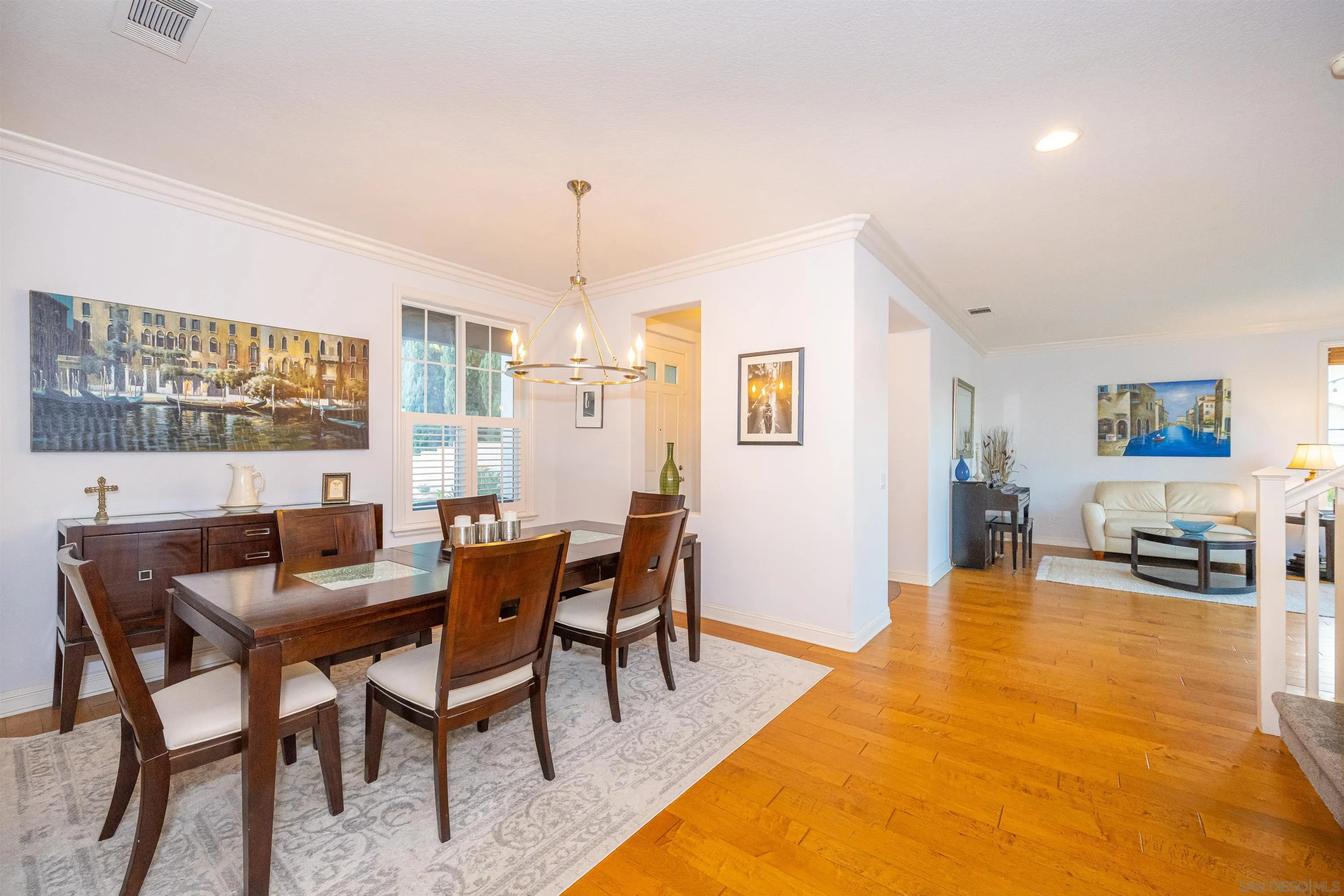 1540 Weatherly Road Carlsbad, CA 92011 - Photo 28 of 58 a view of a dining room with furniture and wooden floor