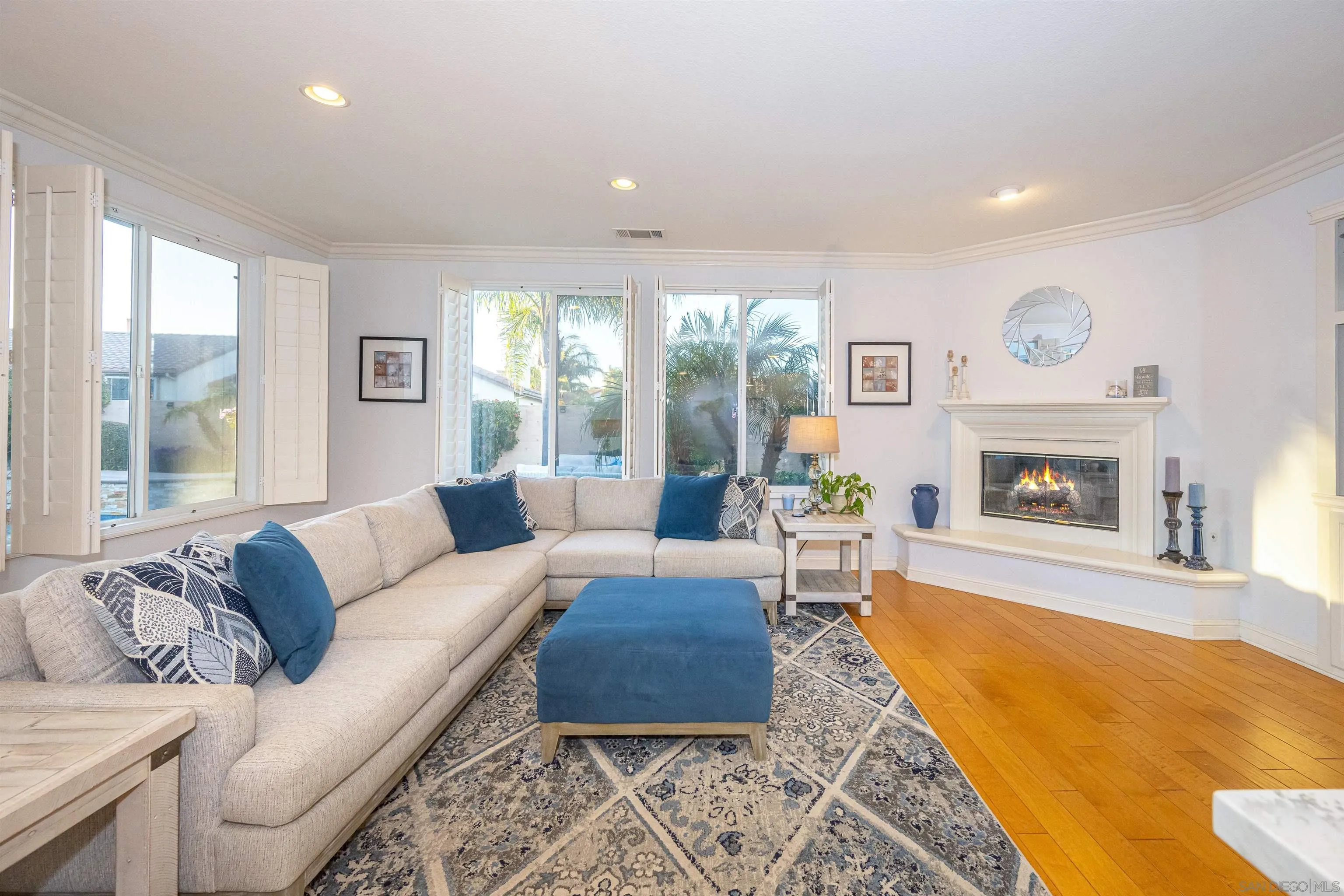 1540 Weatherly Road Carlsbad, CA 92011 - Photo 39 of 58 a living room with furniture and a fireplace