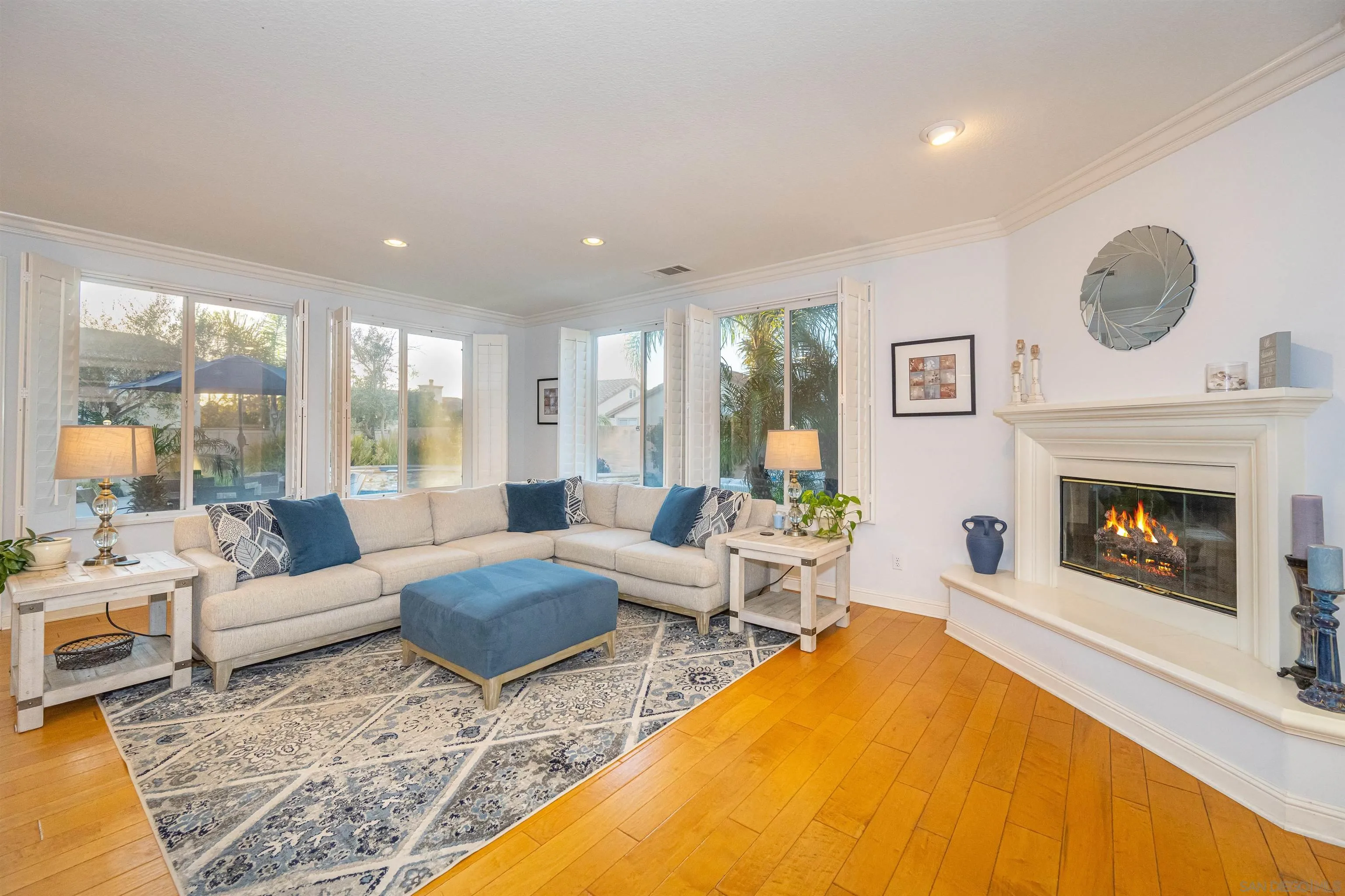 1540 Weatherly Road Carlsbad, CA 92011 - Photo 4 of 58 a living room with furniture and a fireplace