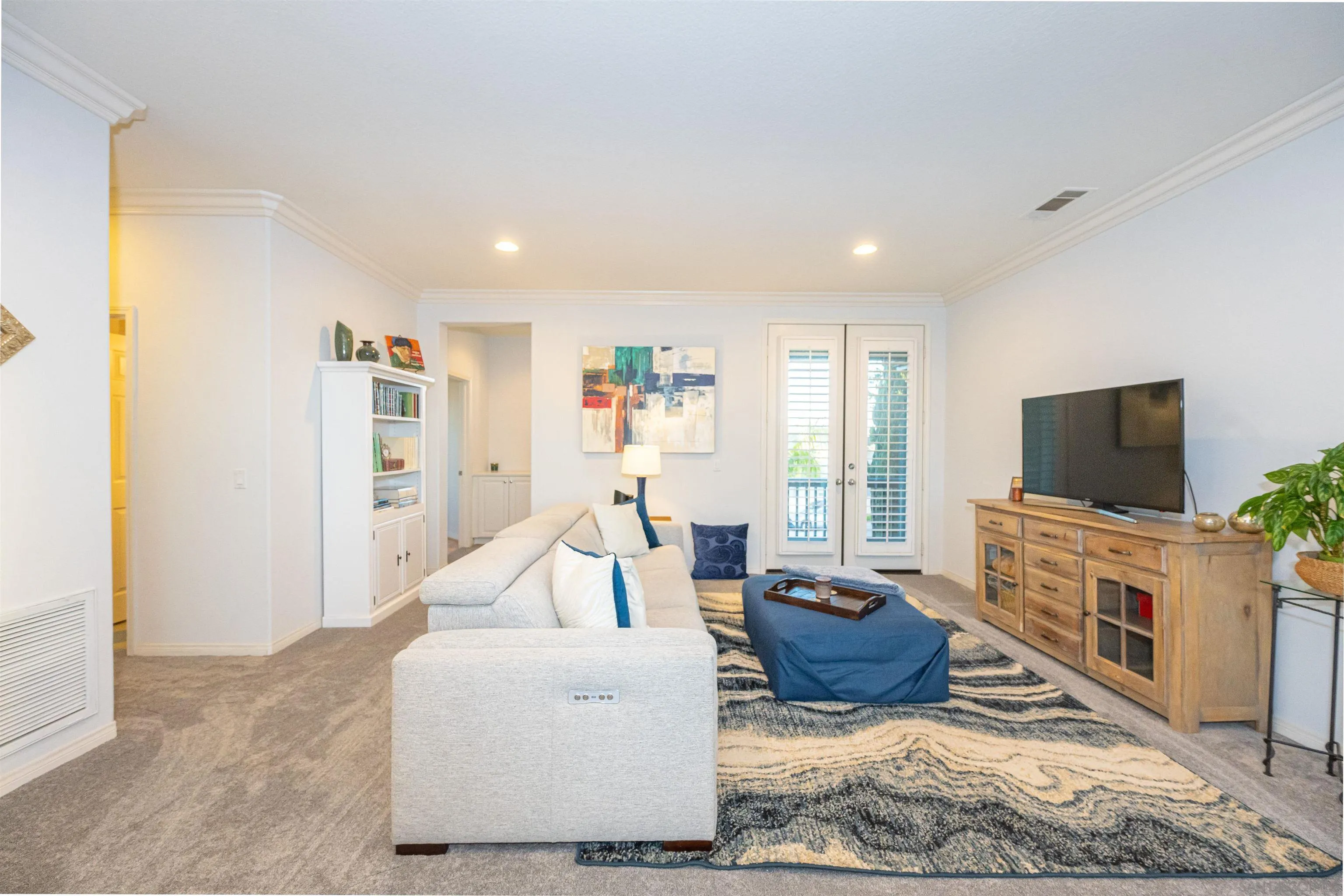 1540 Weatherly Road Carlsbad, CA 92011 - Photo 43 of 58 a living room with furniture and a flat screen tv