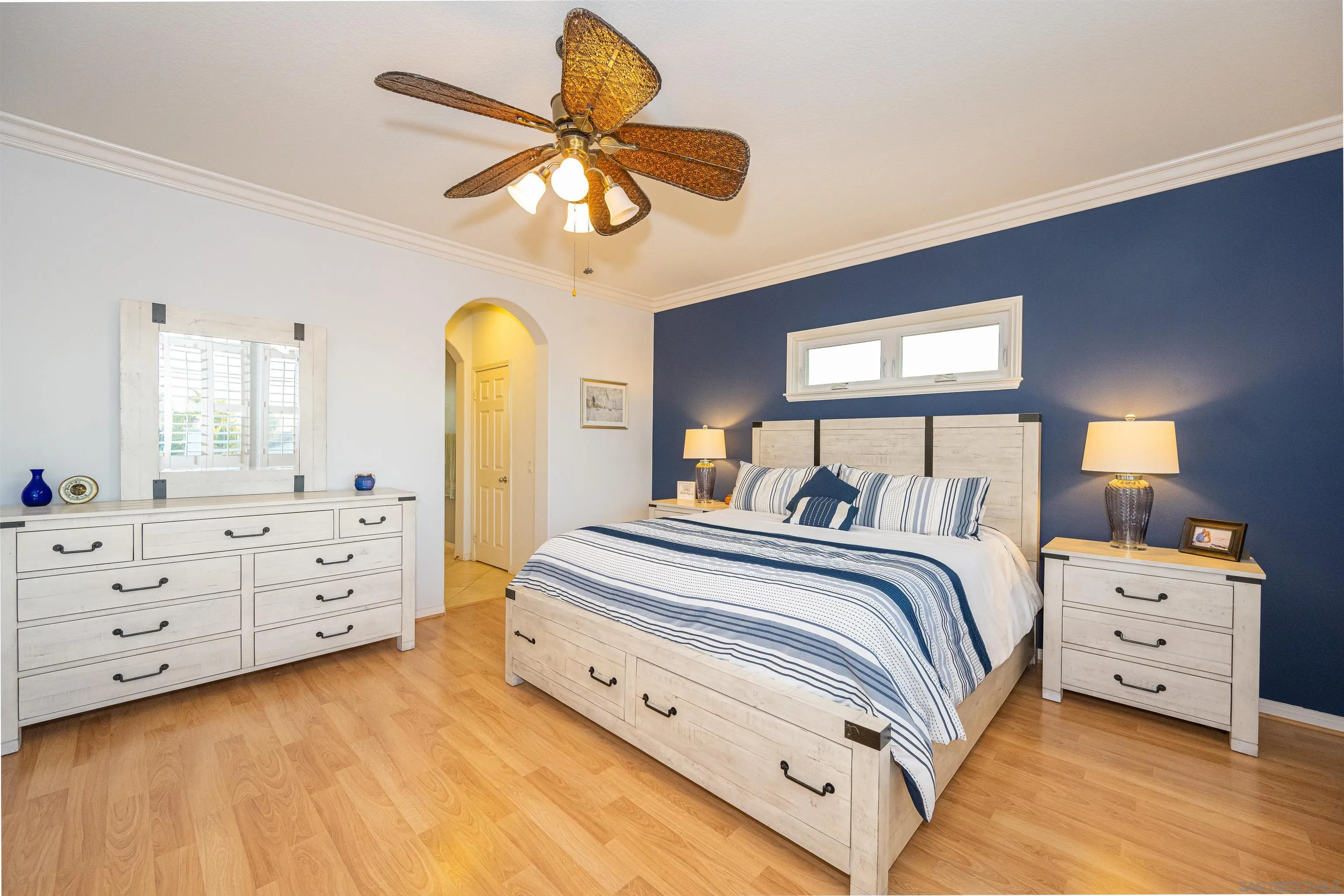 1540 Weatherly Road Carlsbad, CA 92011 - Photo 10 of 58 a bedroom with a bed and a chandelier
