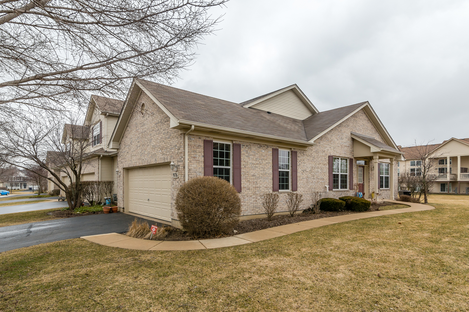 976 Oak Ridge Boulevard Elgin, IL 60120 - Photo 1 of 39 a view of a white house next to a road and yard