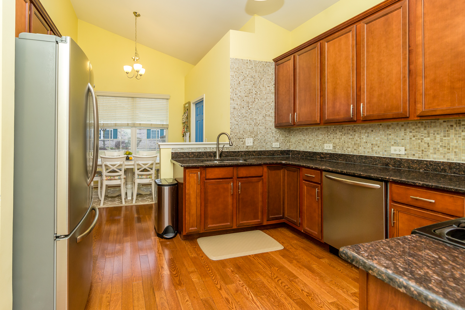 976 Oak Ridge Boulevard Elgin, IL 60120 - Photo 12 of 39 a kitchen with stainless steel appliances granite countertop wooden cabinets a sink and dishwasher