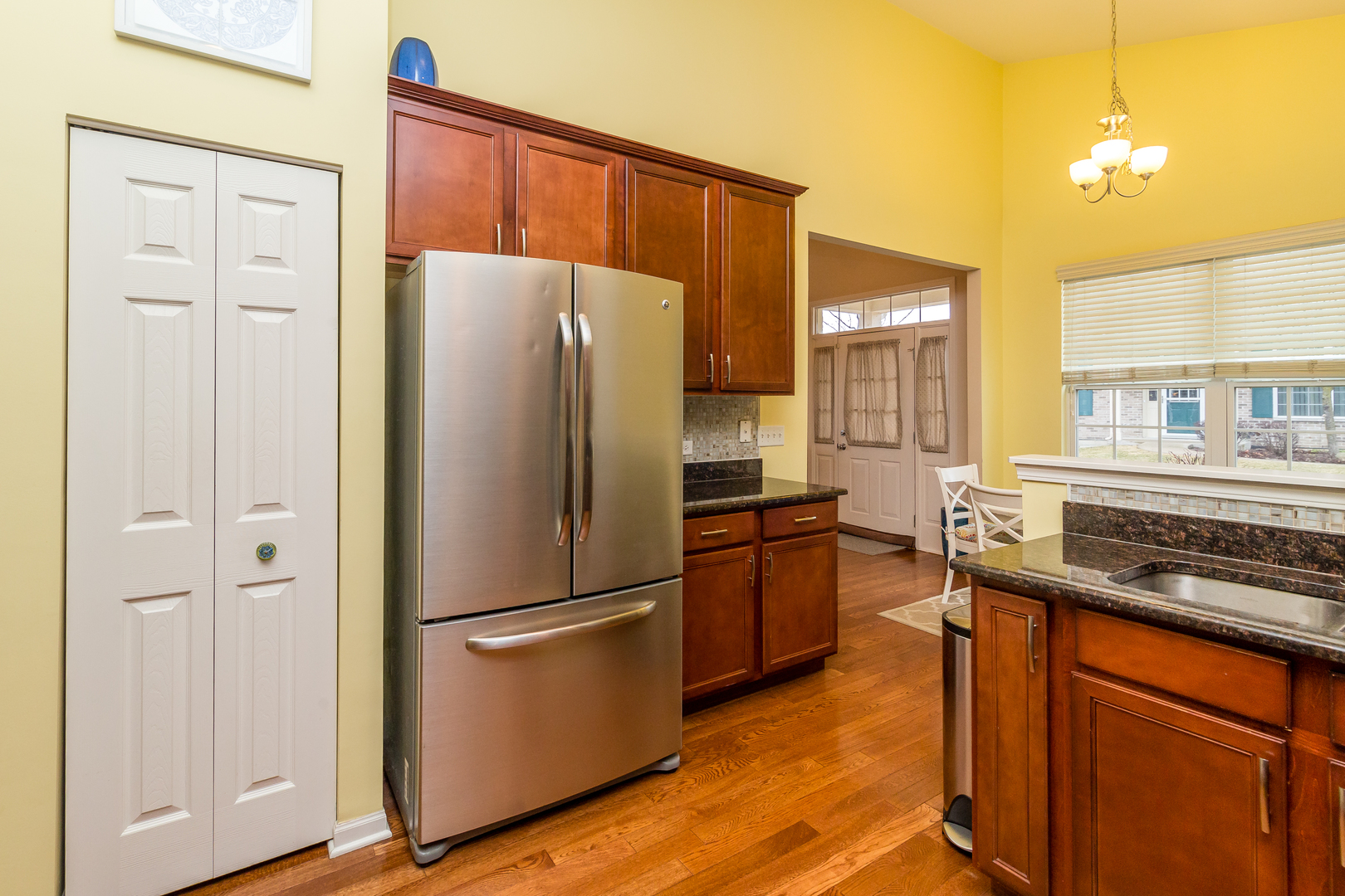 976 Oak Ridge Boulevard Elgin, IL 60120 - Photo 13 of 39 a kitchen with stainless steel appliances granite countertop a refrigerator a sink and white cabinets