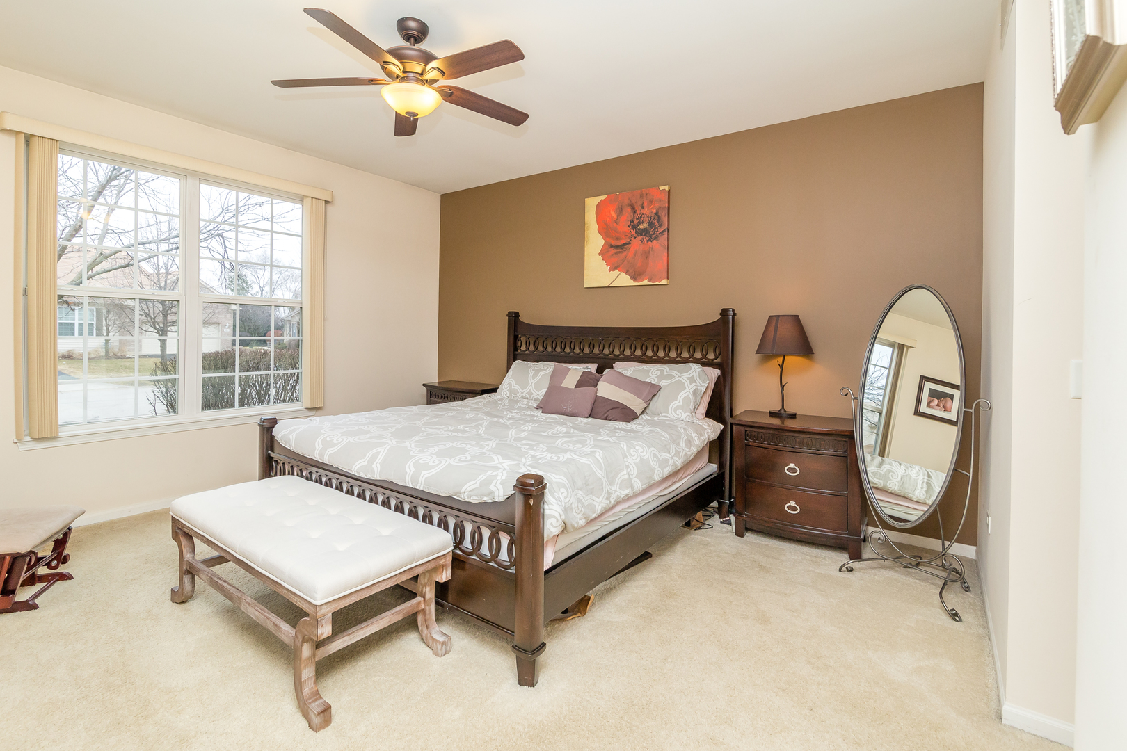 976 Oak Ridge Boulevard Elgin, IL 60120 - Photo 17 of 39 a bedroom with a bed dresser and a window