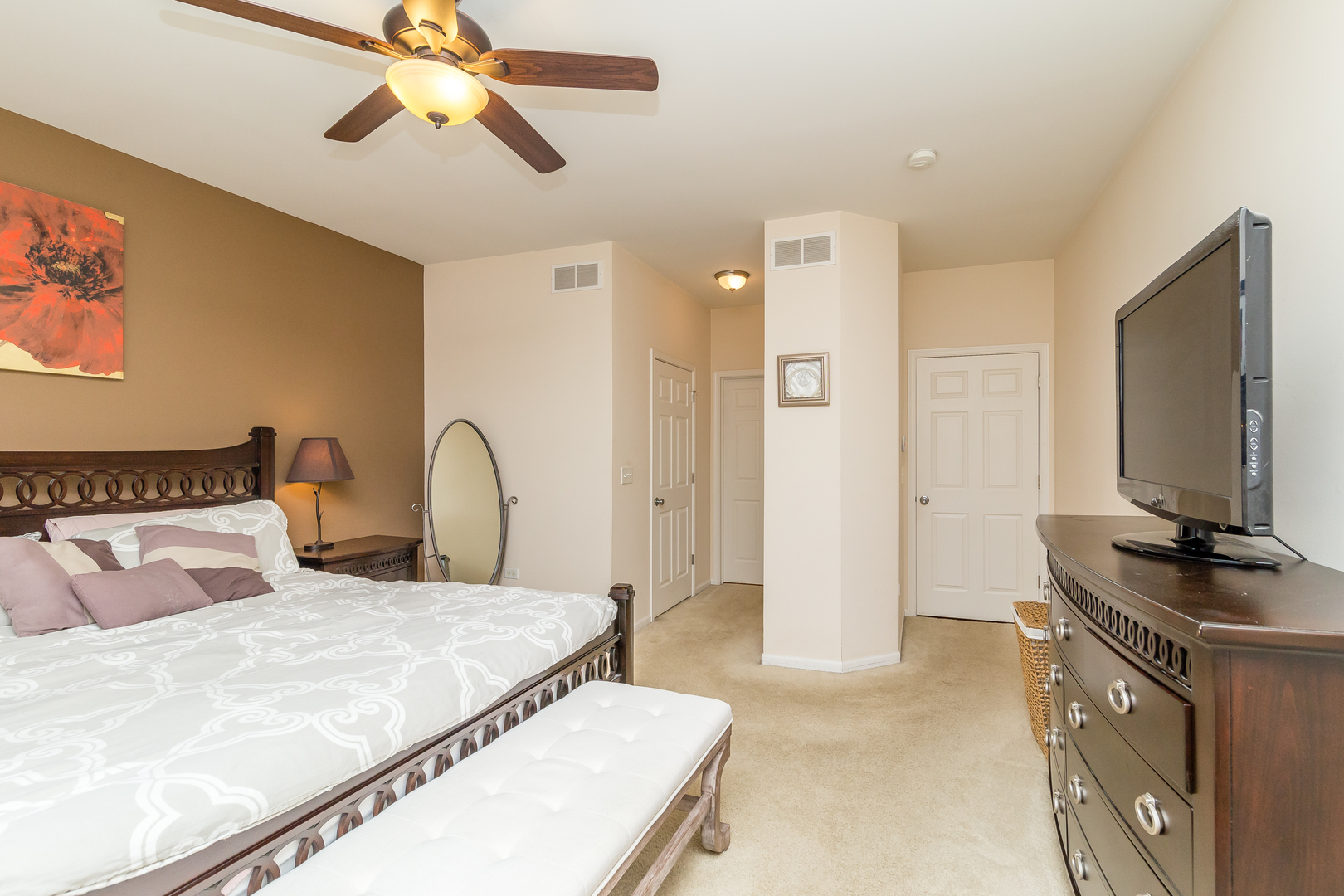 976 Oak Ridge Boulevard Elgin, IL 60120 - Photo 18 of 39 a bedroom with a bed and a flat screen tv