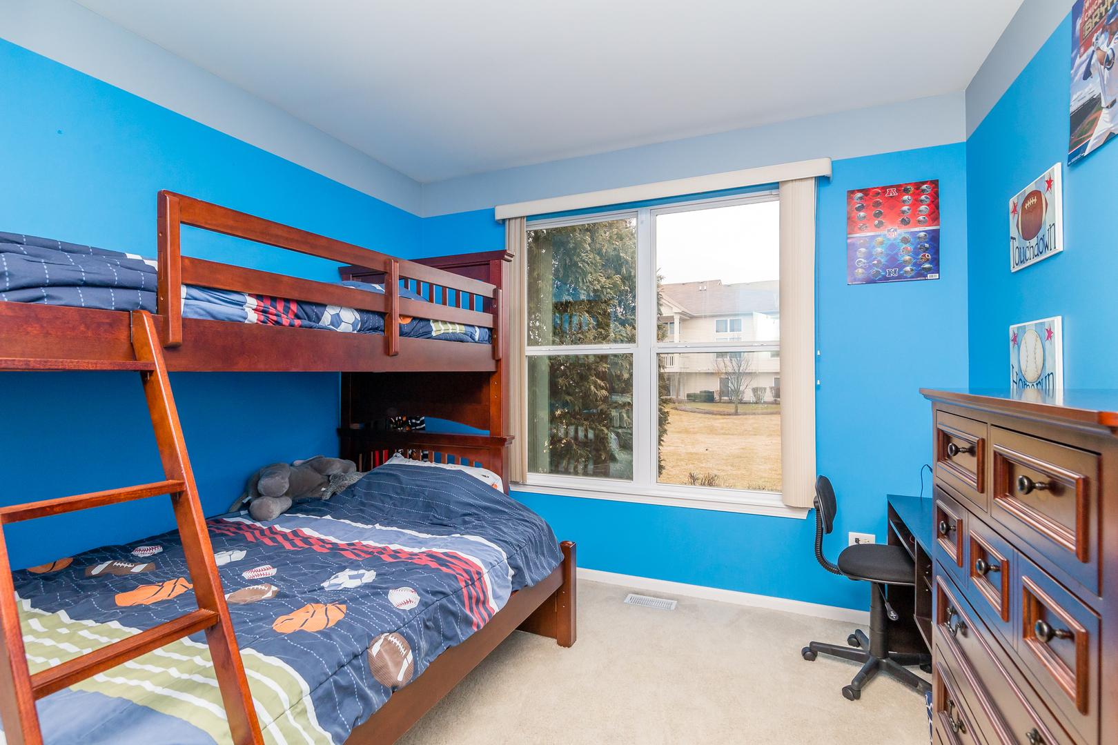 976 Oak Ridge Boulevard Elgin, IL 60120 - Photo 22 of 39 a bedroom with a bed and a window