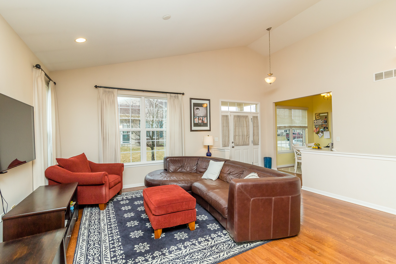 976 Oak Ridge Boulevard Elgin, IL 60120 - Photo 8 of 39 a living room with furniture a large window and a chandelier