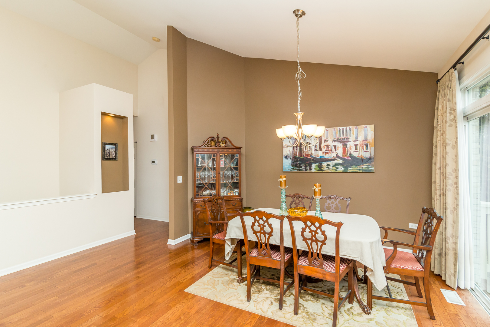 976 Oak Ridge Boulevard Elgin, IL 60120 - Photo 9 of 39 a dining room with furniture a rug and wooden floor