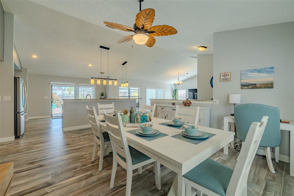 222 Halton Circle Seffner, FL 33584 - Photo 13 of 57 a view of a dining room with furniture and wooden floor