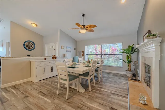 a kitchen with granite countertop a stove and a wooden floors