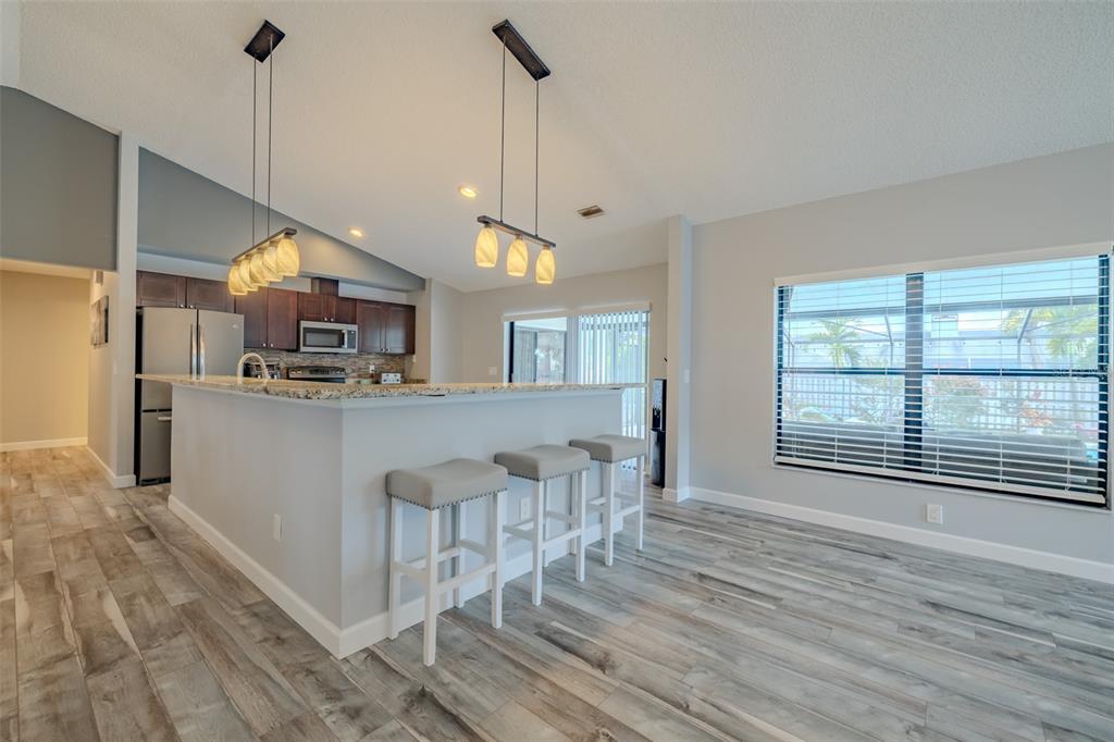 222 Halton Circle Seffner, FL 33584 - Photo 15 of 57 a view of a kitchen with furniture and wooden floor